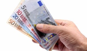 Euro notes or bills in male hand
